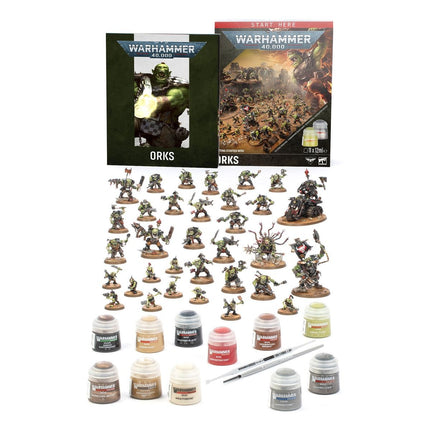 Warhammer 40.000 starterset met Orks, inclusief miniaturen en accessoires voor beginners, op een speeloppervlak.