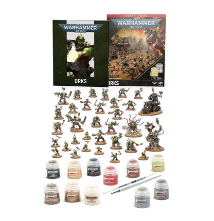 Warhammer 40.000 starterset met Orks, inclusief miniaturen en accessoires voor beginners, op een speeloppervlak.