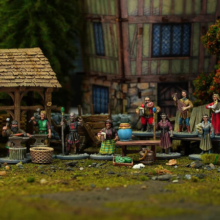 Miniaturen van Villagers 2 Elves en Dwarves van Wargames Atlantic, weergegeven in de doos met gedetailleerde figuren en kleurrijke details.